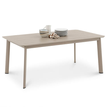 Beige outdoor table with plates and cups on a white background